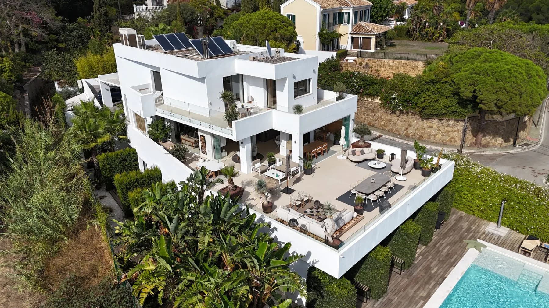 Aerial photograph of a modern home, terrace and pool